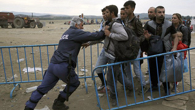 Police pushing refugees back